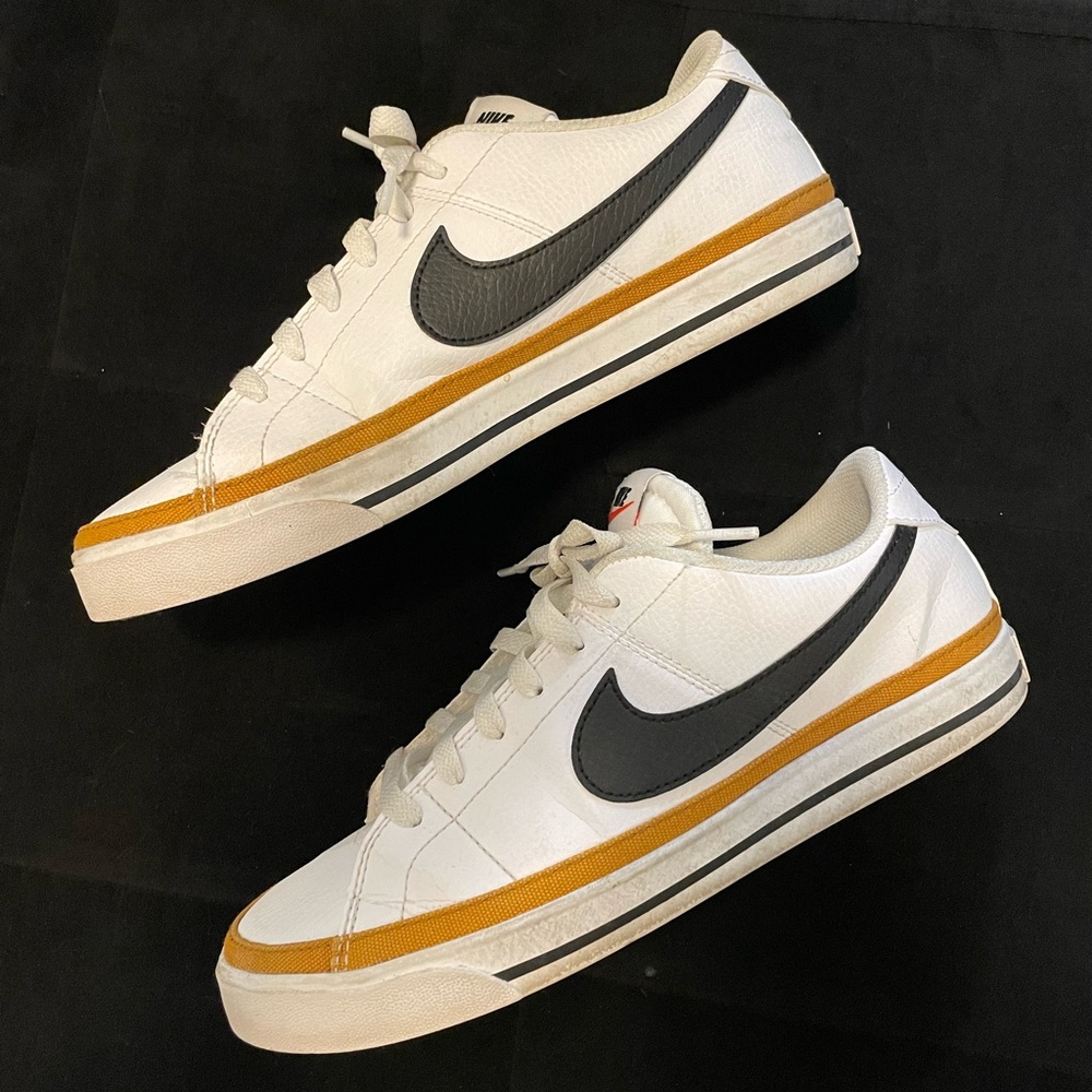 Nike Men's White and Black Sneakers with Gold Accents